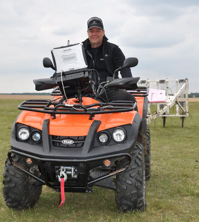 Wolfgang Neubauer operates a motorised multisensor magnetometer during the geophysical archaeological prospection field campaign in Stonehenge. Credit: LBI ArchPro.
